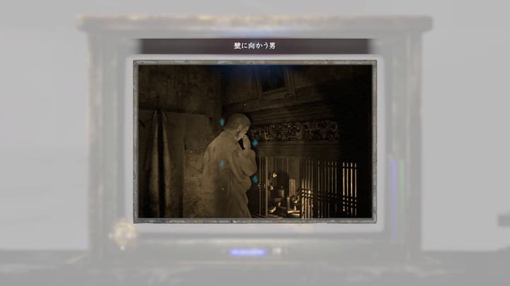 壁に向かう男